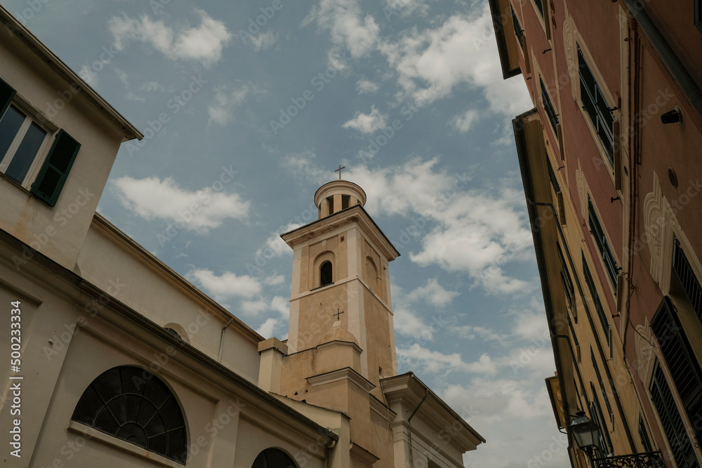 Facade of Basilica di Santa Maria di Nazareth across the blue sky from beneath in Sestri Levante, Liguria, Italy 