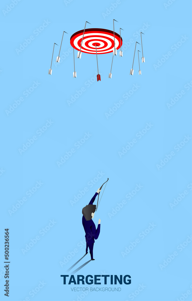 Businessman in suit shoot the arrow to target . Business Concept of marketing target and customer. Businessman in suit shoot the arrow to target . Business Concept of marketing target and customer.