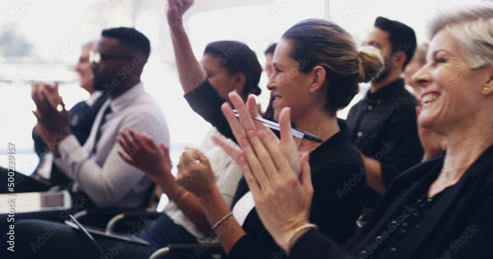 That talk deserve a round of applause. group of businesspeople clapping hands while sitting in a conference. Diverse happy businesspeople clapping during a meeting. Smiling businesspeople clapping.