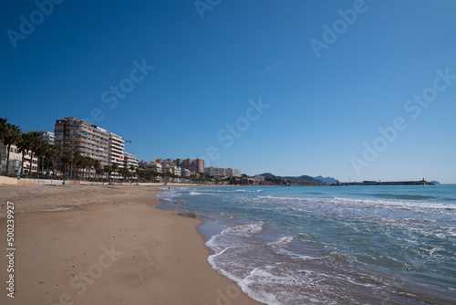 Villajoyosa Spain near Benidorm with waves and blue sea and sky Costa Blanca Alicante