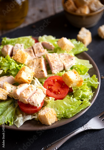 Delicious vegetable salad with lettuce, tomatoes and chicken