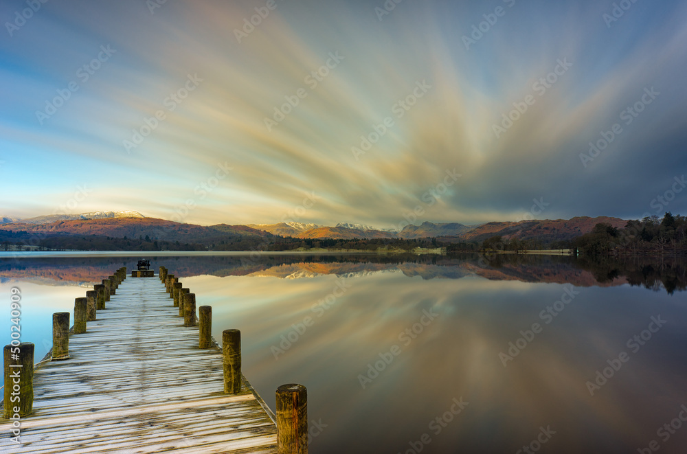 Long exposure early morning on Windermere lake, with frosty jetty and beautiful reflections