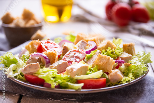 Delicious vegetable salad with lettuce, tomatoes and chicken