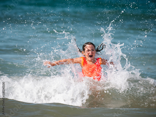 happy girl covered by a sea wave © 23_stockphotography