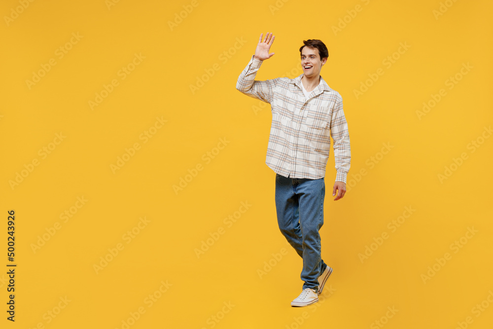 Full body young smiling happy cheerful caucasian man 20s wearing