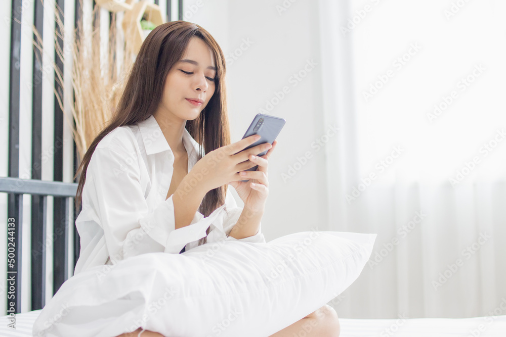 Portrait young smile happy beautiful asian woman relax bedroom. woman relax use smartphone gadget online shopping work from home. Portrait young smile happy beautiful asian woman relax bedroom. woman relax use smartphone gadget online shopping work from home.