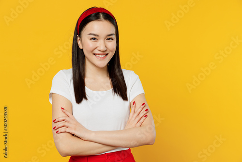 Canvastavla Amazing magnificent fun young girl woman of Asian ethnicity 20s years old wears white t-shirt hold hands crossed isolated on plain yellow background studio portrait