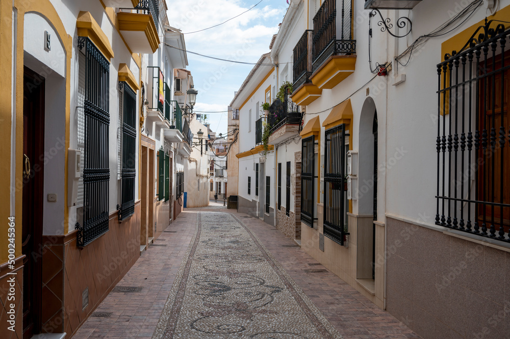 Travel destination, small Andalusian town Nerja with white houses and narrow streets on Costa del Sol, Spain