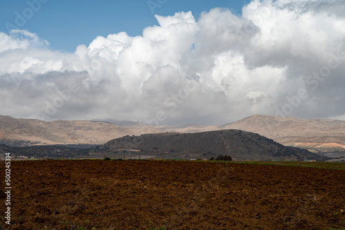 Panoramic view on agricultural valley Zafarraya with fertile soils for growing of vegetables, green lettuce salad, cabbage, artichokes, Andalusia, Spain photo