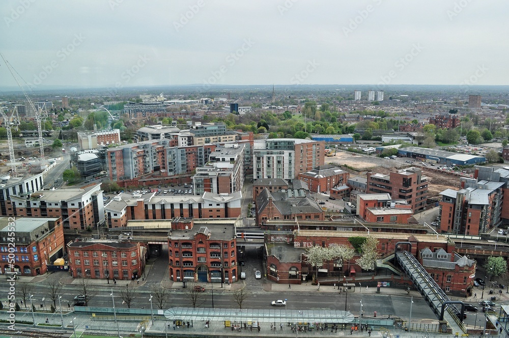 Aerial view of the city with a grey sky background. Taken in Manchester England. 