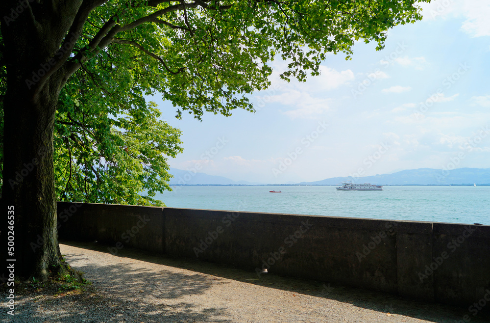 Bodensee or lake Constance on a fine sunny spring day on island Lindau with the Alps in the background, Germany