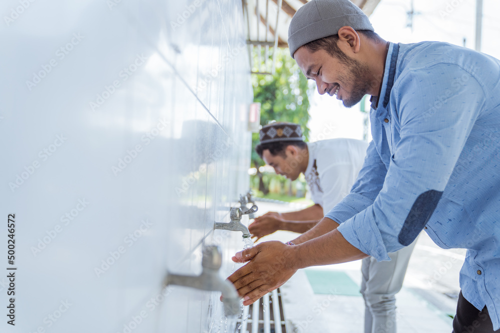 portrait of asian Man muslim perform ablution or wudu at the mosque portrait of asian Man muslim perform ablution or wudu at the mosque