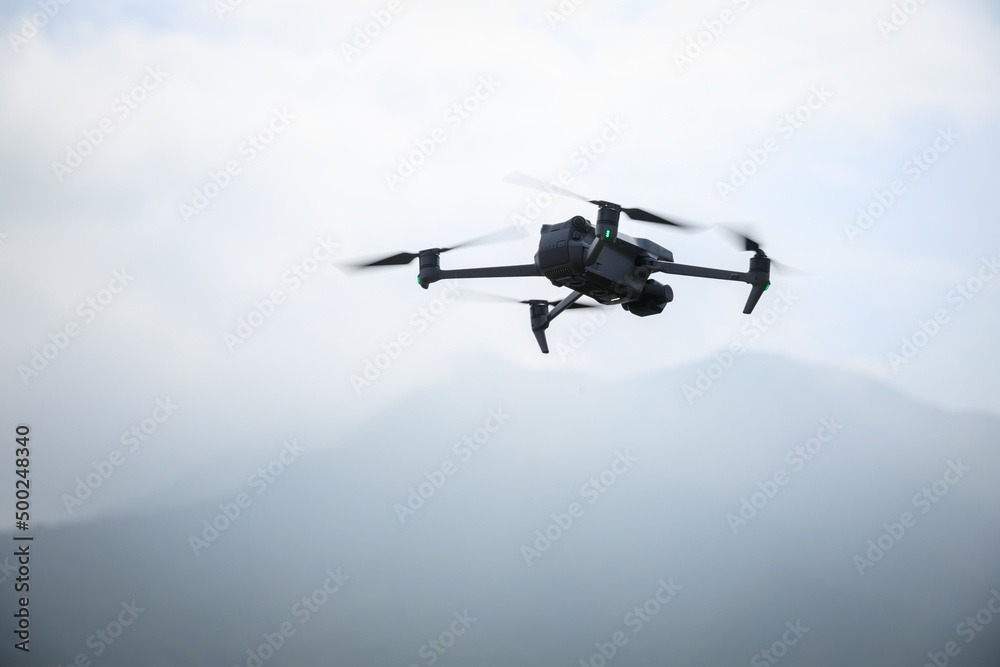 Drone flying in spring forest Drone flying in spring forest
