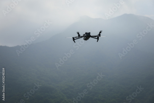 Fototapeta Naklejka Na Ścianę i Meble -  Drone flying in spring forest