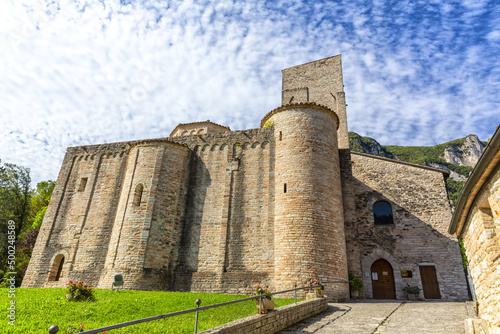 San Vittore alle Chiuse. Roman Catholic abbey and church. The edifice is known from the year 1011. Ponte Romano. Roman bridge over a small river. Italy. photo