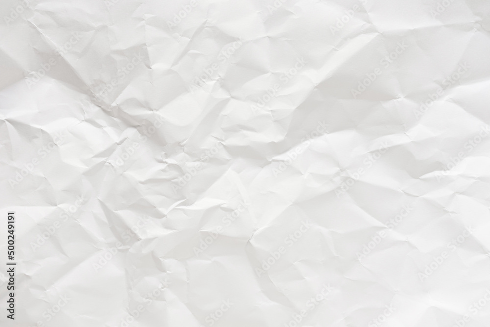 Fototapeta premium White crumpled paper texture background.