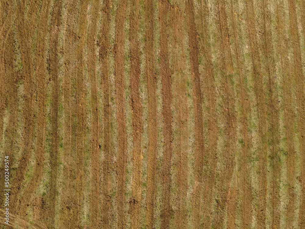 Drone view of fertilized agricultural field in the spring