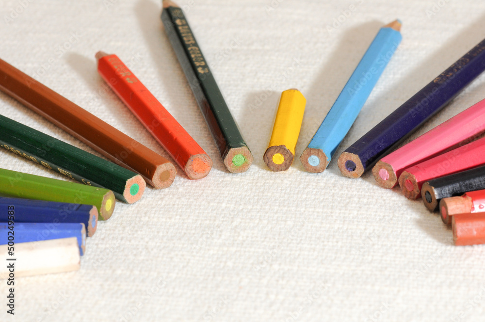 Colorful and funny arrangement of a set of pencils and ink pots.