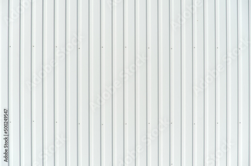 White metal facade wall with vertical lines