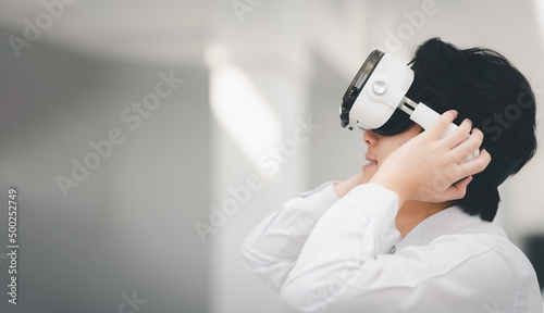 Man Using VR 3-D Glasses Future technology gaming ewith virtual reality headset or 3d glasses photo