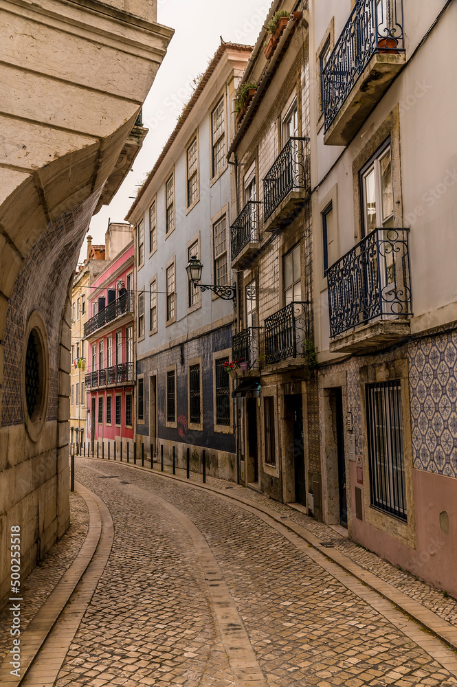 A view down a side street leading off Figueira Square in the Alfama distict in the city of Lisbon on a spring day