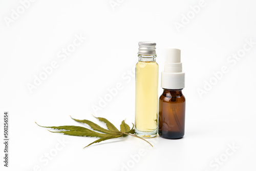 cannabis oil extract in a bottle , hemp oil marijuana leaves isolated on white background, herbal medicine and health care concept