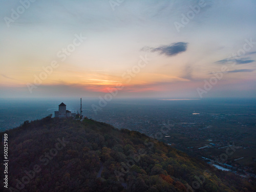 Fortress over the town of Vršac and the sunset. Aerial photography.