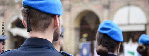 Obraz na płótnie Horizontal banner or header with some soldiers in blue uniform of the Italian army including women in Bologna, Italy