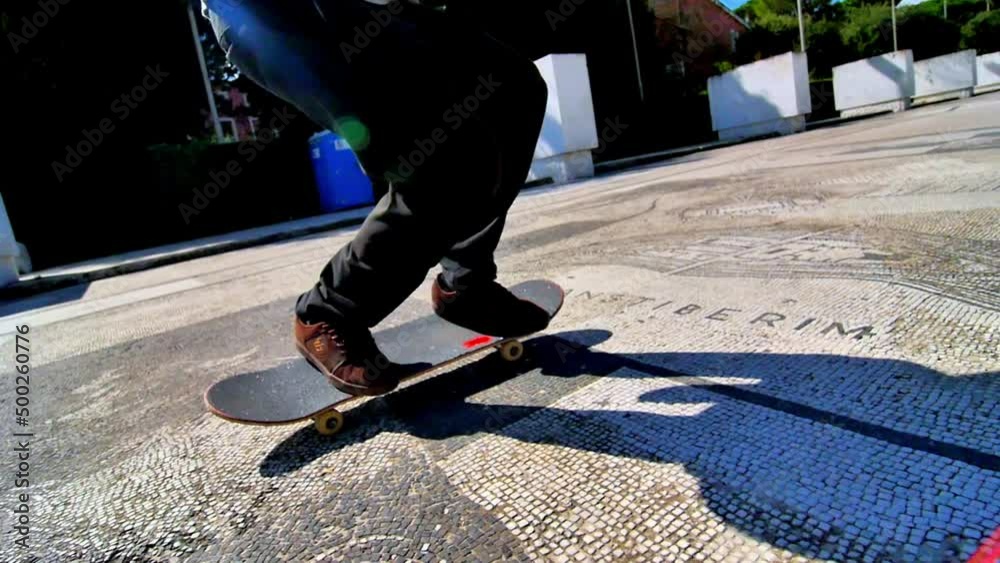 travelling dolly detail of the feet of a skater doing tricks with his skateboard on top of some Roman mosaics with wonderful themes, colors and varied shapes