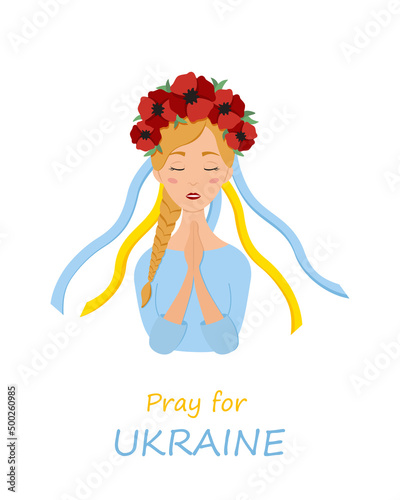 Beautiful ukrainian woman in a wreath with poppies prays for Ukraine. Stop war.