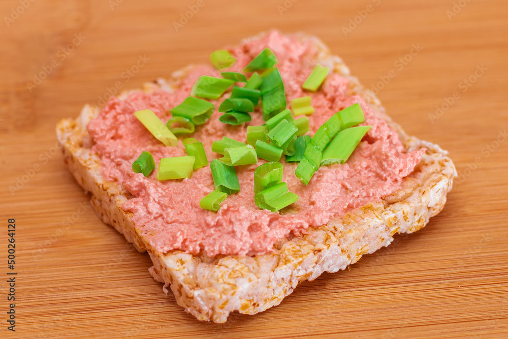 Rice Cake Sandwich with Fish Cream and Green Onions on Bamboo Cutting Board. Easy Breakfast. Diet Food. Quick and Healthy Sandwiches. Crispbread with Tasty Filling. Healthy Dietary Snack