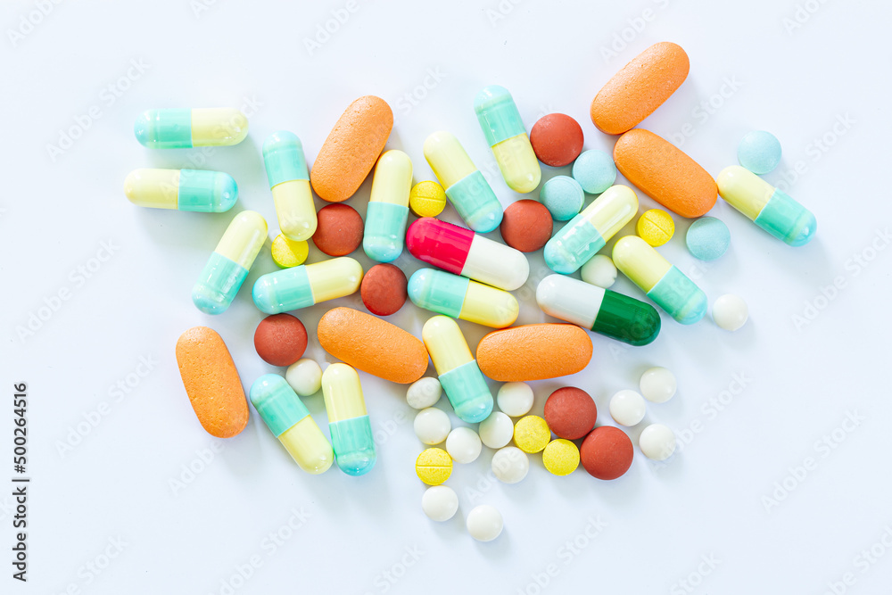 Pills on a white background,Stack of different pills isolated on white background Pills on a white background,Stack of different pills isolated on white background