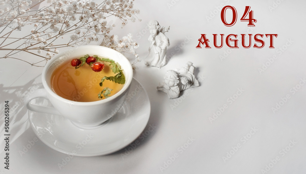 calendar date on light background with a porcelain cup of green tea, white gypsophila and angels with copy space. August 4 is the fourth day of the month calendar date on light background with a porcelain cup of green tea, white gypsophila and angels with copy space. August 4 is the fourth day of the month