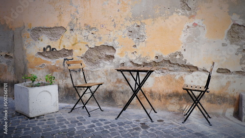 Fototapeta Naklejka Na Ścianę i Meble -  table with chair on the Italian street
