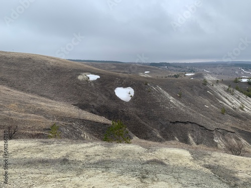 snowy white heart on the slope of a chalk hill