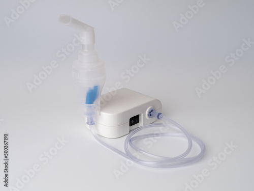 Medical equipment for inhalation with mouthpiece, nebulizer on a white background. Respiratory medicine. Asthma breathing treatment. Bronchitis, asthmatic health equipment