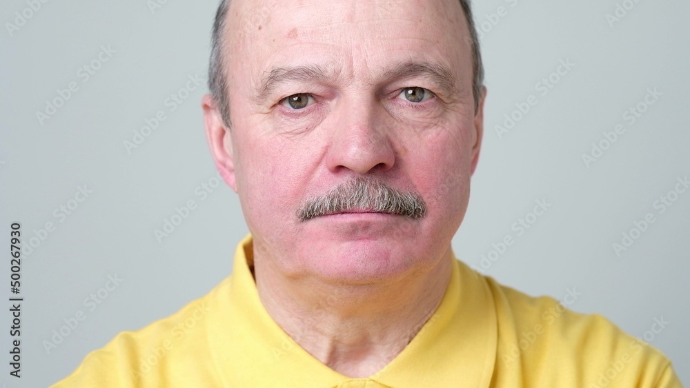 Fototapeta premium Mature adult man laughing looking at the camera. Positive emotion concept