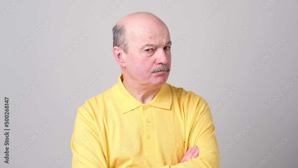 Not sure. Mature adult in shirt having a doubt Not sure. Mature adult in shirt having a doubt