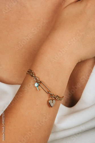 female gold bracelet on girl hand, female accessory, jewelry, gold bracelet with stone, female jewelry, girl bracelet on her arm, gold bracelet with stone