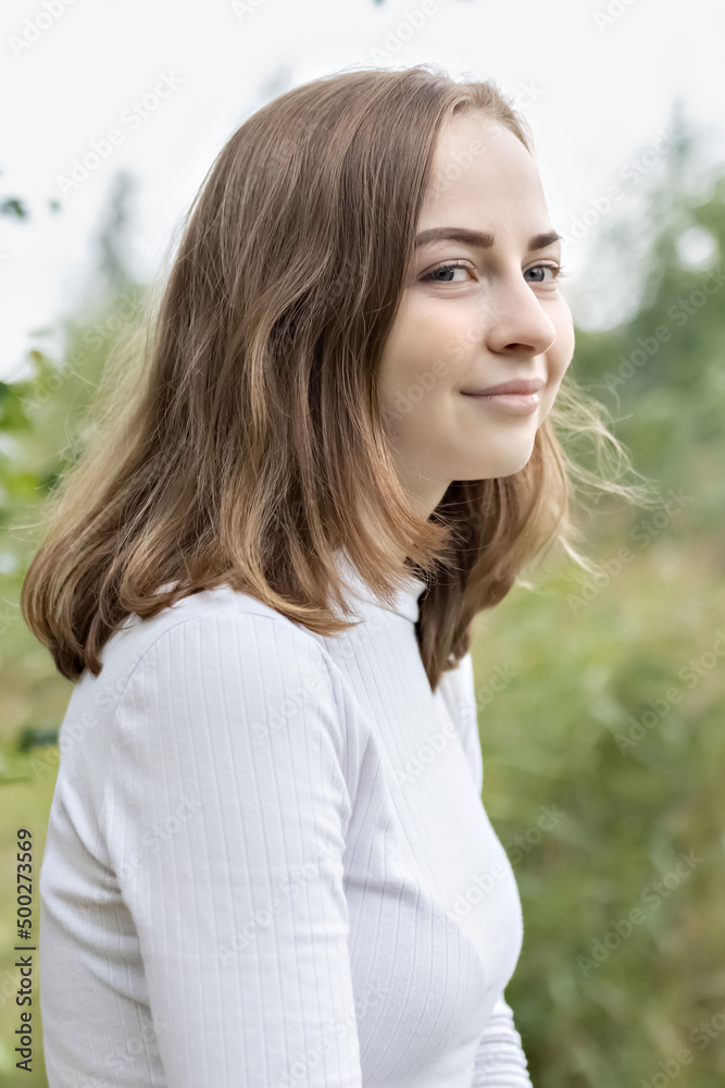 Portrait of a young teenager girl in the park. Spring. Portrait of a young teenager girl in the park. Spring.