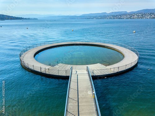 Aerial image of the public swimming pool at the Zurich lake side with a wooden circle toddler pond