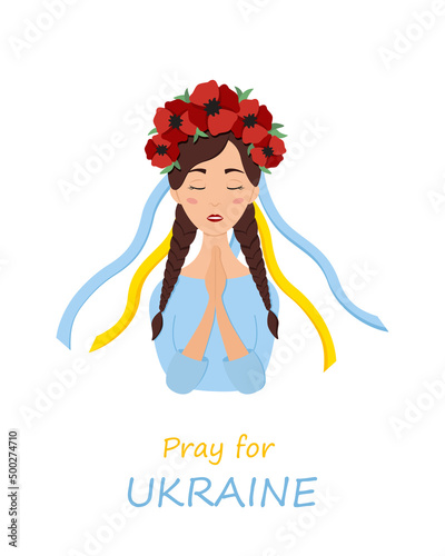 Beautiful ukrainian woman in a wreath with poppies prays for Ukraine. Stop war.