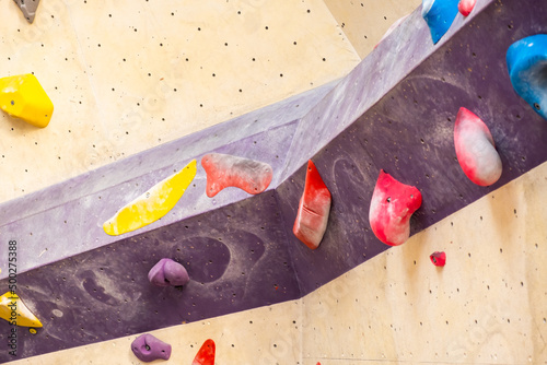 Stone hook on the artificial climbing wall in bouldering gym.  photo