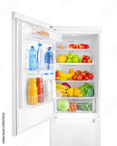 Open fridge full of vegetables, fruits and drinks isolated on white wall background.