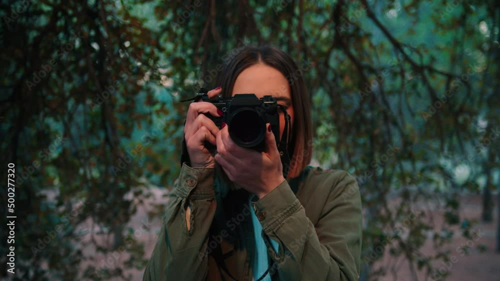 Close Up Of Female Photographer Taking Photos In The Woodlands. Close Up Of Female Photographer Taking Photos In The Woodlands.