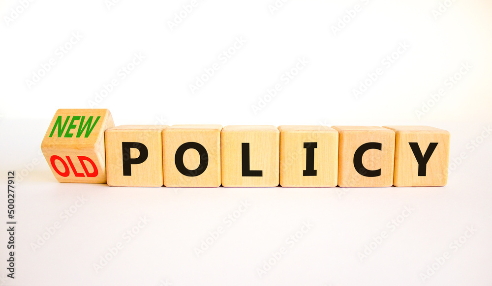 New or old policy symbol. Turned wooden cubes changed concept words Old policy to New policy. Beautiful white table white background. Business old or new policy concept. Copy space. New or old policy symbol. Turned wooden cubes changed concept words Old policy to New policy. Beautiful white table white background. Business old or new policy concept. Copy space.