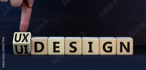 UX user experience design or UI user interface design symbol. Turned wooden cubes and changed words UX design to UI design. Beautiful grey background. Business UX or UI design concept. Copy space.