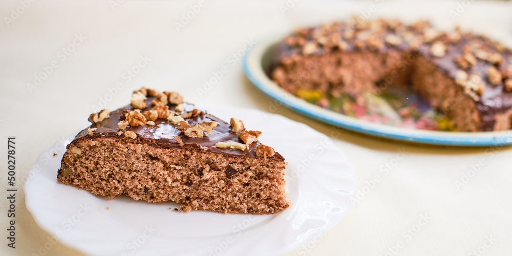 Piece of walnut cake with chocolate Piece of walnut cake with chocolate