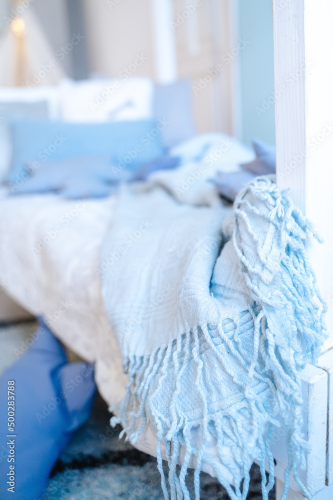 Blue blanket on the bed Blue blanket on the bed