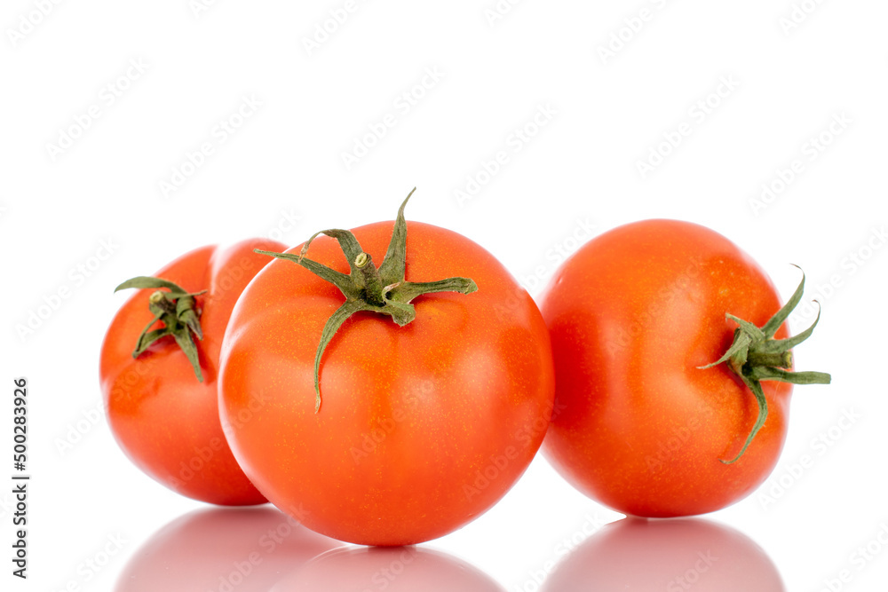 Three red ripe tomatoes, macro, isolated on a white background. Three red ripe tomatoes, macro, isolated on a white background.